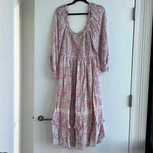 Long sleeve smocked bodice maxi dress with trim at skirt. Size L